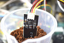 Electronic component with wiring in a container of soil